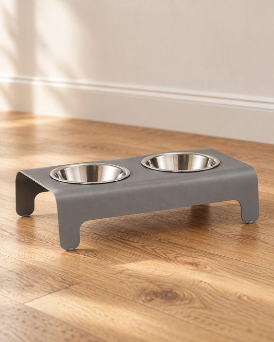 Grey Labbvenn Rico double pet feeder on a warm wooden floor